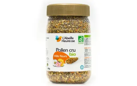 Un pot de pollen cru mille fleurs bio de L'Abeille Heureuse, rempli de granules dorés et orangés.